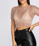 With fun and flirty details, Sparkly Dreams Sheer Crop Top shows off your unique style for a trendy outfit for the summer season!
