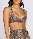 With fun and flirty details, Statement Snake Bustier Crop Top shows off your unique style for a trendy outfit for the summer season!