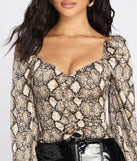 With fun and flirty details, Chic Satin Snake Print Top shows off your unique style for a trendy outfit for the summer season!
