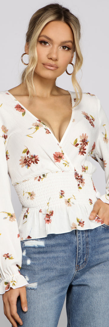 With fun and flirty details, Smocked Long Sleeve Floral Surplice Gauze Top shows off your unique style for a trendy outfit for the summer season!