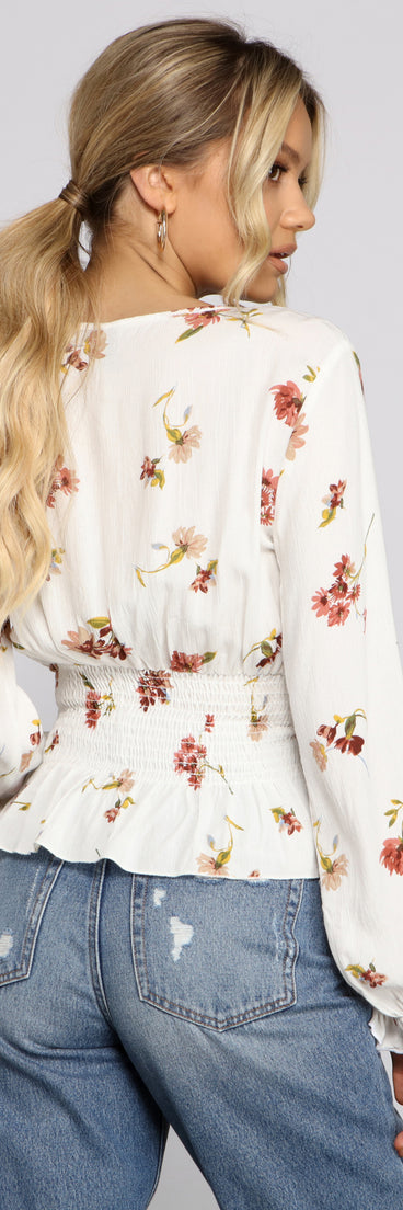 With fun and flirty details, Smocked Long Sleeve Floral Surplice Gauze Top shows off your unique style for a trendy outfit for the summer season!