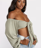 With fun and flirty details, Long Sleeve Gauze Tie Front Crop Top shows off your unique style for a trendy outfit for the summer season!