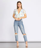 With fun and flirty details, In Bloom Floral Crop Top shows off your unique style for a trendy outfit for the summer season!
