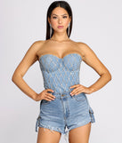 With fun and flirty details, Rhinestone Diva Denim Corset Top shows off your unique style for a trendy outfit for the summer season!