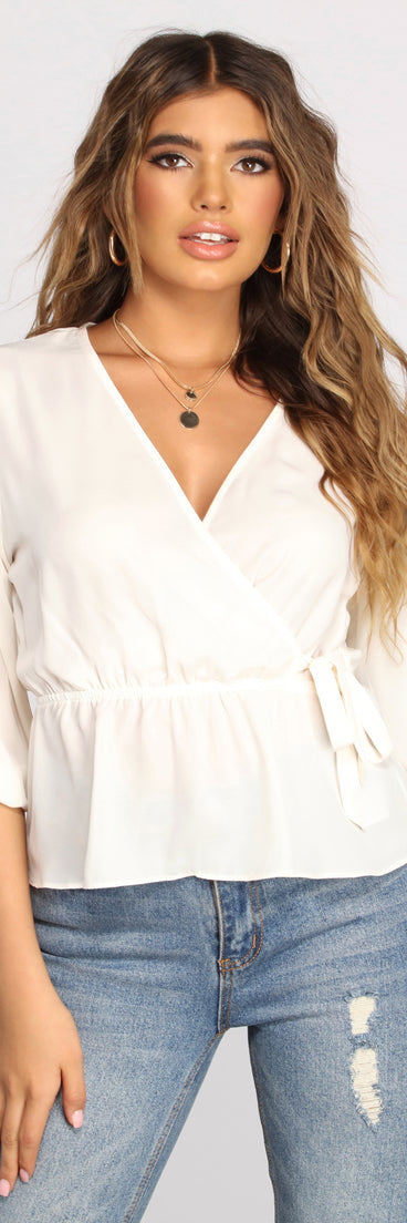 With fun and flirty details, Wrapped In Classic Style Blouse shows off your unique style for a trendy outfit for the summer season!