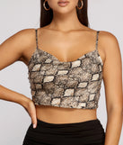 With fun and flirty details, Sleek Satin Snake Crop Top shows off your unique style for a trendy outfit for the summer season!