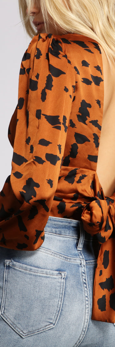 With fun and flirty details, Satin Leopard Print Open Back Top shows off your unique style for a trendy outfit for the summer season!