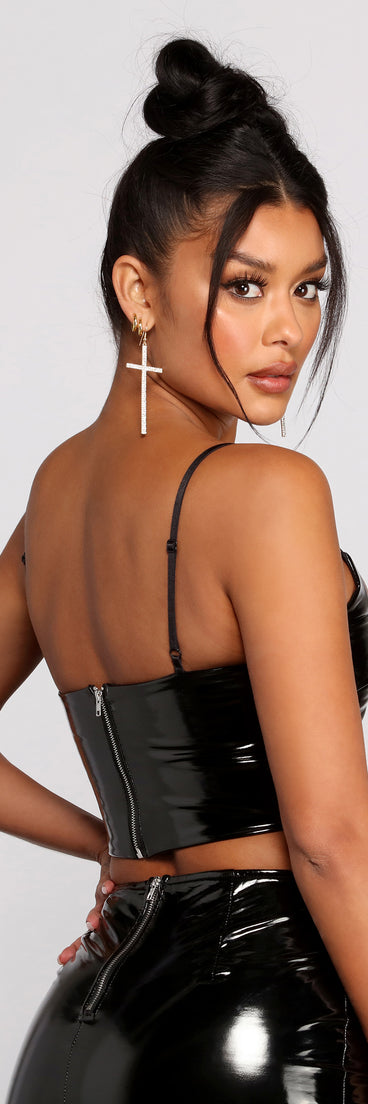 With fun and flirty details, Dangerous Woman Faux Patent Leather Crop Top shows off your unique style for a trendy outfit for the summer season!