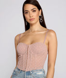 With fun and flirty details, So Glam Swiss Dot Corset Crop Top shows off your unique style for a trendy outfit for the summer season!
