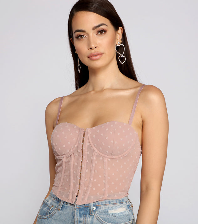 With fun and flirty details, So Glam Swiss Dot Corset Crop Top shows off your unique style for a trendy outfit for the summer season!