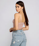 With fun and flirty details, So Glam Swiss Dot Corset Crop Top shows off your unique style for a trendy outfit for the summer season!