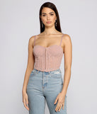 With fun and flirty details, So Glam Swiss Dot Corset Crop Top shows off your unique style for a trendy outfit for the summer season!