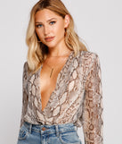 With fun and flirty details, Snake Charmer Chiffon Surplice Bodysuit shows off your unique style for a trendy outfit for the summer season!