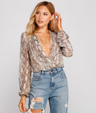 With fun and flirty details, Snake Charmer Chiffon Surplice Bodysuit shows off your unique style for a trendy outfit for the summer season!