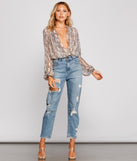 With fun and flirty details, Snake Charmer Chiffon Surplice Bodysuit shows off your unique style for a trendy outfit for the summer season!