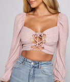 With fun and flirty details, Lace-Up Gingham Crop Top shows off your unique style for a trendy outfit for the summer season!