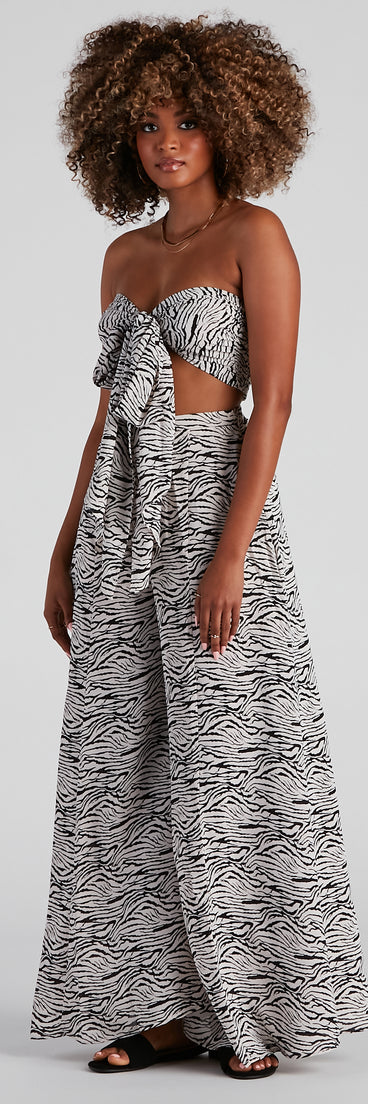 With fun and flirty details, Eye Of The Tiger Bandeau Crop Top shows off your unique style for a trendy outfit for the summer season!