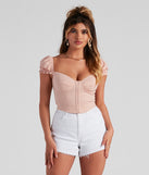 With fun and flirty details, Cutie Pie Cap Sleeve Corset Top shows off your unique style for a trendy outfit for the summer season!