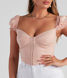 With fun and flirty details, Cutie Pie Cap Sleeve Corset Top shows off your unique style for a trendy outfit for the summer season!