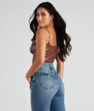 With fun and flirty details, She's Sleek Faux Leather Cropped Corset shows off your unique style for a trendy outfit for the summer season!