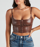 With fun and flirty details, She's Sleek Faux Leather Cropped Corset shows off your unique style for a trendy outfit for the summer season!