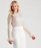 The trendy Flawless Glam Sequin Feather Trim Crop Top is the perfect pick to create a holiday outfit, new years attire, cocktail outfit, or party look for any seasonal event!