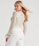 With fun and flirty details, Flawless Glam Sequin Feather Trim Crop Top shows off your unique style for a trendy outfit for the summer season!