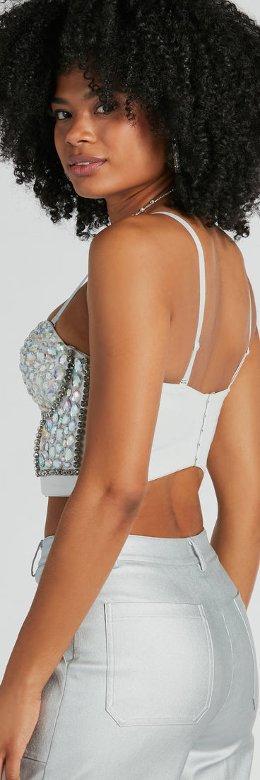 The waist-defining bodice style of the Magnificent Glamour Rhinestone Bustier is perfect for making a statement with your outfit and provides the boning, molded cups, or lace-up details that capture the corset trend.