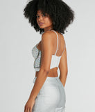 The waist-defining bodice style of the Magnificent Glamour Rhinestone Bustier is perfect for making a statement with your outfit and provides the boning, molded cups, or lace-up details that capture the corset trend.