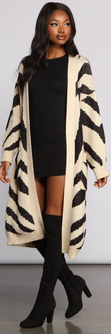 With fun and flirty details, Zebra Print Long Line Cardigan shows off your unique style for a trendy outfit for the summer season!
