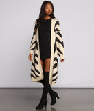 With fun and flirty details, Zebra Print Long Line Cardigan shows off your unique style for a trendy outfit for the summer season!
