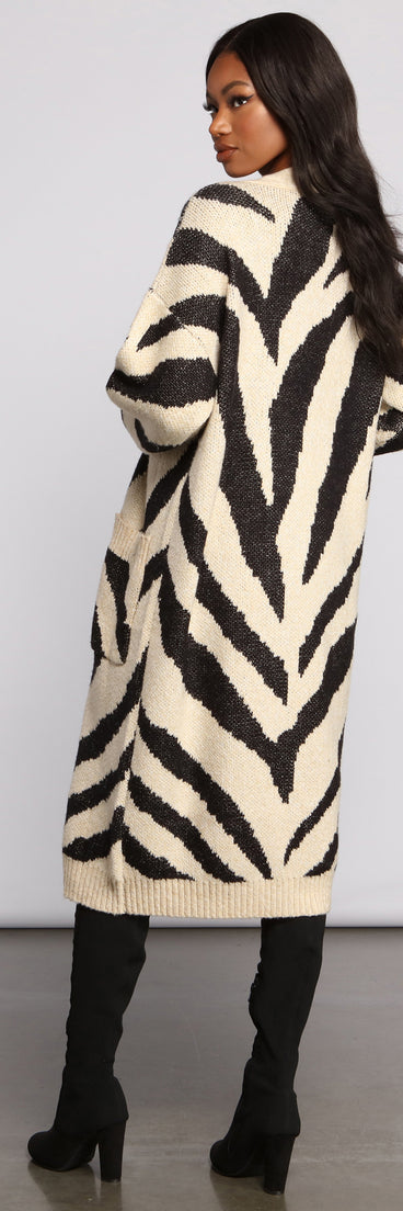 With fun and flirty details, Zebra Print Long Line Cardigan shows off your unique style for a trendy outfit for the summer season!