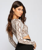 With fun and flirty details, Vamp It Up Snake Tie Front Top shows off your unique style for a trendy outfit for the summer season!