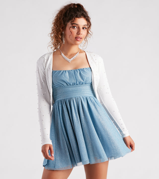 With fun and flirty details, Elegant Touch Pearl Embellished Bolero shows off your unique style for a trendy outfit for the summer season!