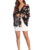 With fun and flirty details, Ring Around In Florals Top shows off your unique style for a trendy outfit for the summer season!