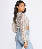 With fun and flirty details, Snake Print Long Sleeve Crop Top shows off your unique style for a trendy outfit for the summer season!