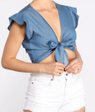 With fun and flirty details, Why Knot Flutter Sleeve Chambray Tie Front Top shows off your unique style for a trendy outfit for the summer season!