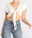 With fun and flirty details, Tied Down Flutter Sleeve Tie Front Top shows off your unique style for a trendy outfit for the summer season!