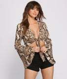 With fun and flirty details, Stunning Snake Print Bell Sleeve Top shows off your unique style for a trendy outfit for the summer season!