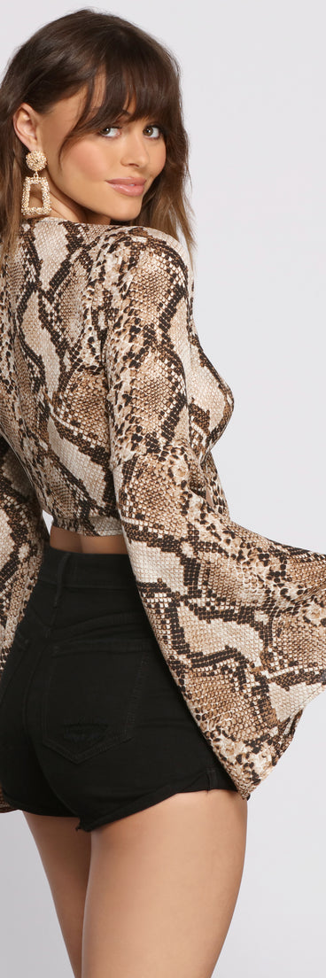 With fun and flirty details, Stunning Snake Print Bell Sleeve Top shows off your unique style for a trendy outfit for the summer season!