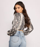 With fun and flirty details, Chic Satin Snake Print Crop Top shows off your unique style for a trendy outfit for the summer season!