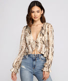 With fun and flirty details, Fab N'Fierce Snake Print Ruffled Top shows off your unique style for a trendy outfit for the summer season!