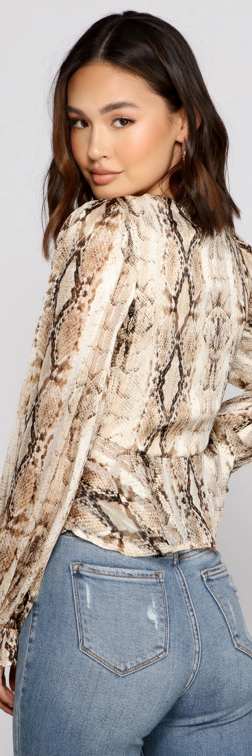 With fun and flirty details, Fab N'Fierce Snake Print Ruffled Top shows off your unique style for a trendy outfit for the summer season!