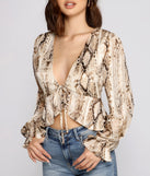 With fun and flirty details, Fab N'Fierce Snake Print Ruffled Top shows off your unique style for a trendy outfit for the summer season!