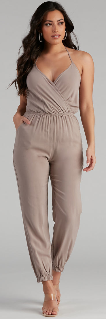 Plunging Into Basics Surplice Jumpsuit provides a stylish start to creating your best summer outfits of the season with on-trend details for 2023!