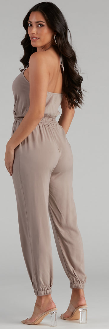 Plunging Into Basics Surplice Jumpsuit provides a stylish start to creating your best summer outfits of the season with on-trend details for 2023!