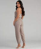 Plunging Into Basics Surplice Jumpsuit provides a stylish start to creating your best summer outfits of the season with on-trend details for 2023!