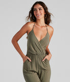 Plunging Into Basics Surplice Jumpsuit provides a stylish start to creating your best summer outfits of the season with on-trend details for 2023!