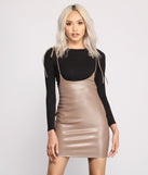 Classic Faux Leather Suspender Mini Skirt provides a stylish start to creating your best summer outfits of the season with on-trend details for 2023!