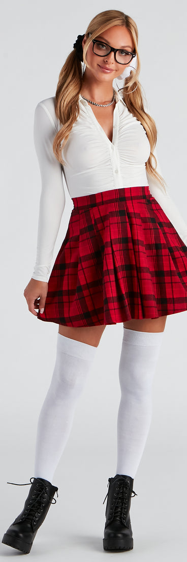 Women's School Girl Costume from Windsor styled with a plaid skirt, white blouse, glasses, white knee-high socks, and women’s black boots